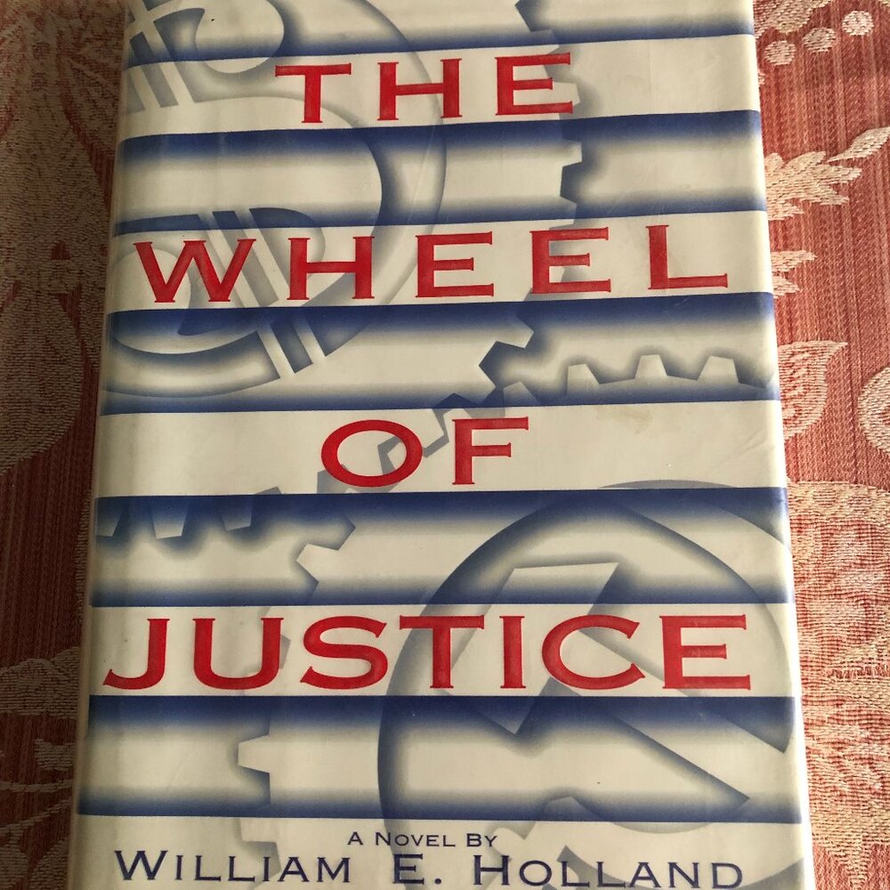 William E Holland, the wheel of justice hard cover first edition book